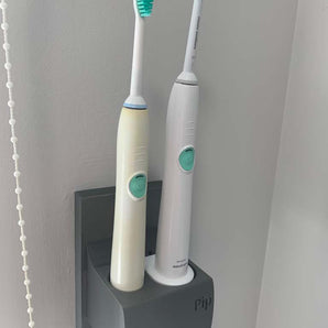 Uchwyt na szczoteczkę do zębów Philips Sonicare ze zintegrowanym systemem zarządzania kablami
