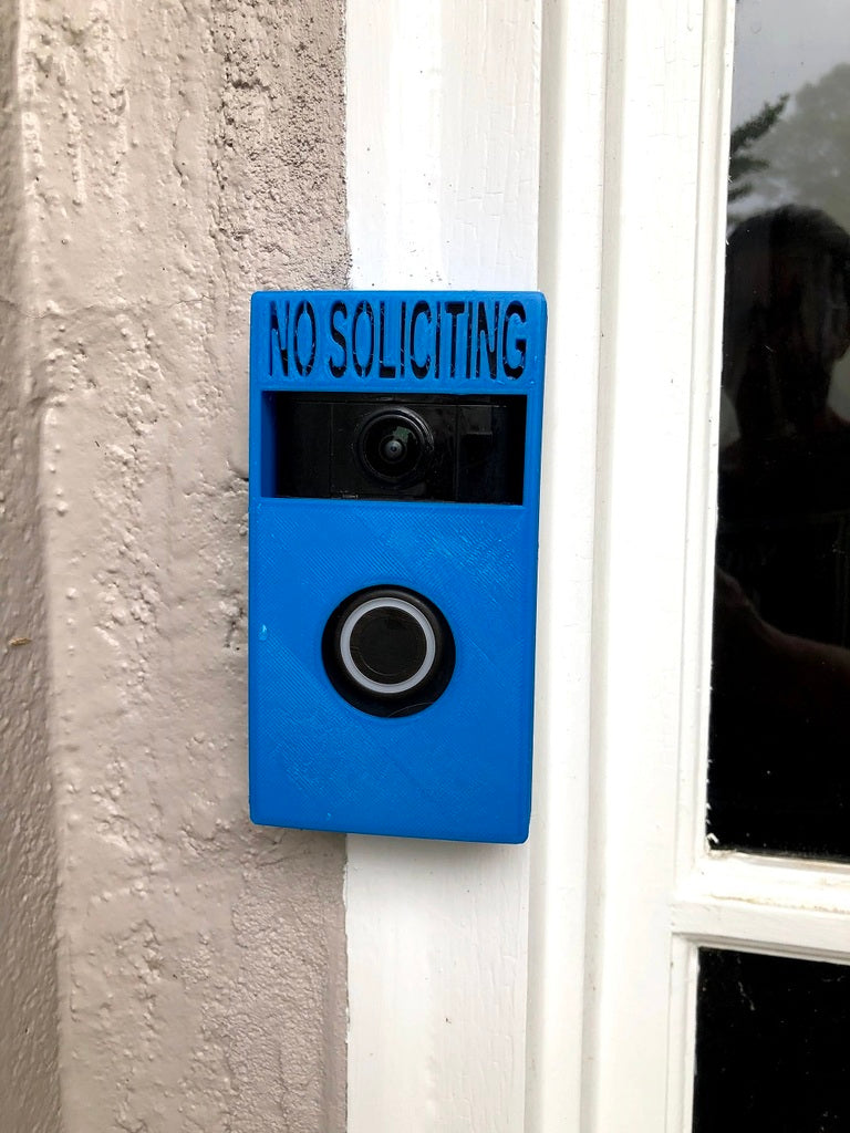 Osłona dzwonka do drzwi z napisem „Zakaz sprzedaży”.